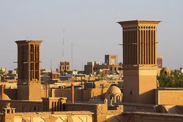 Cityscape at dusk with many windtowers (badgirs), Yazd, Iran, Middle East