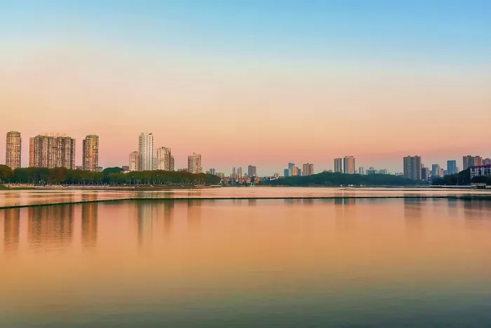 Framed Print : Cityscape of Jiujiang City at sunset over the Sai Lake, Jiangxi Province, China Framed Print : Cityscape of Jiujiang City at sunset over the Sai Lake, Jiangxi Province, China