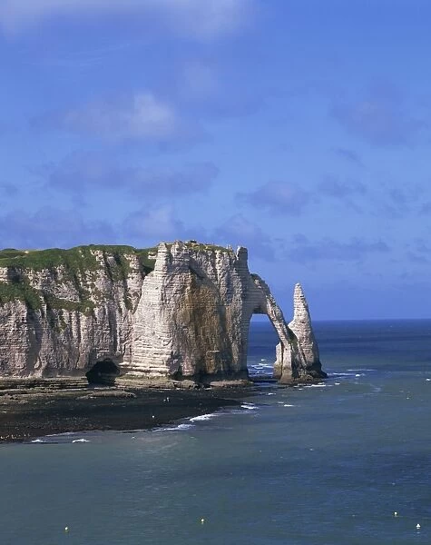 Cliffs and rock arch, known as the Falaises, on the coast near Etretat