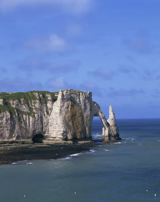Framed Print : Cliffs and rock arch, known as the Falaises, on the coast near Etretat
