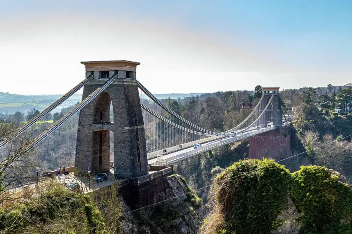 Framed Print : Clifton Suspension Bridge with towers against a clear sky, surrounded by greenery in Bristol, England, United Kingdom, Europe Framed Print : Clifton Suspension Bridge with towers against a clear sky, surrounded by greenery in Bristol, England, United Kingdom, Europe