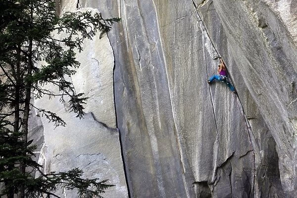 A climber ascending a difficult crack climb, Cadarese Valley, northern Italy, Europe