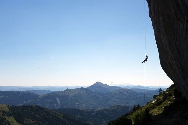 A climber ascends a rope on the cliffs of Ceuse, a mountain in the Alpes Maritimes