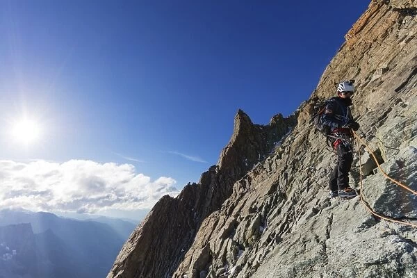 Climber on south ridge of Dent Blanche, 4357m, Valais, Swiss Alps, Switzerland, Europe
