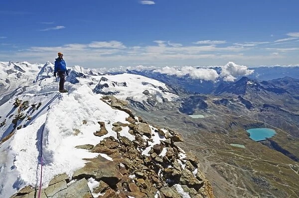 Climber on the summit of the Matterhorn, 4478m, Zermatt, Valais, Swiss Alps, Switzerland, Europe
