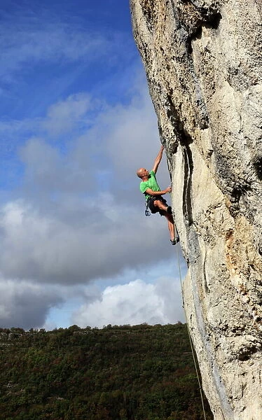 A climber tackles a very difficult rock climb in the Gorge d Aveyron, near St