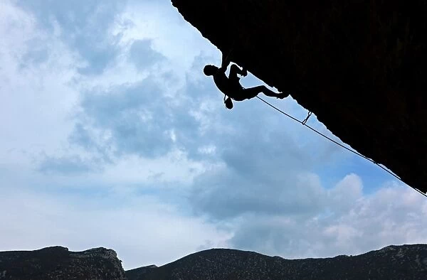 A climber tackles a severely overhanging route in the caves of the Mascun Gorge