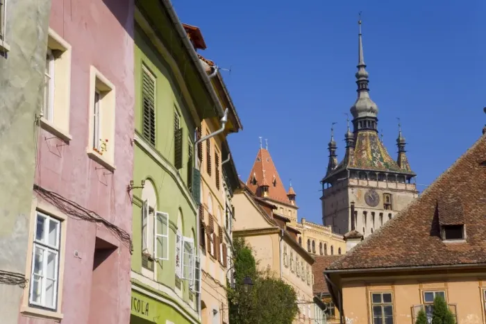 Framed Print : Clock tower (Turnul cu Ceas) and colourfully painted houses, in the medieval old town or citadel