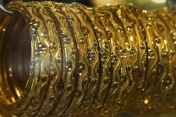 Close up of gold bangles on display