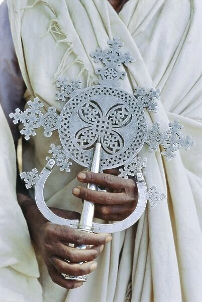Close up of priest holding cross, Church of Narga Selassie, Lake Tana, Gondar