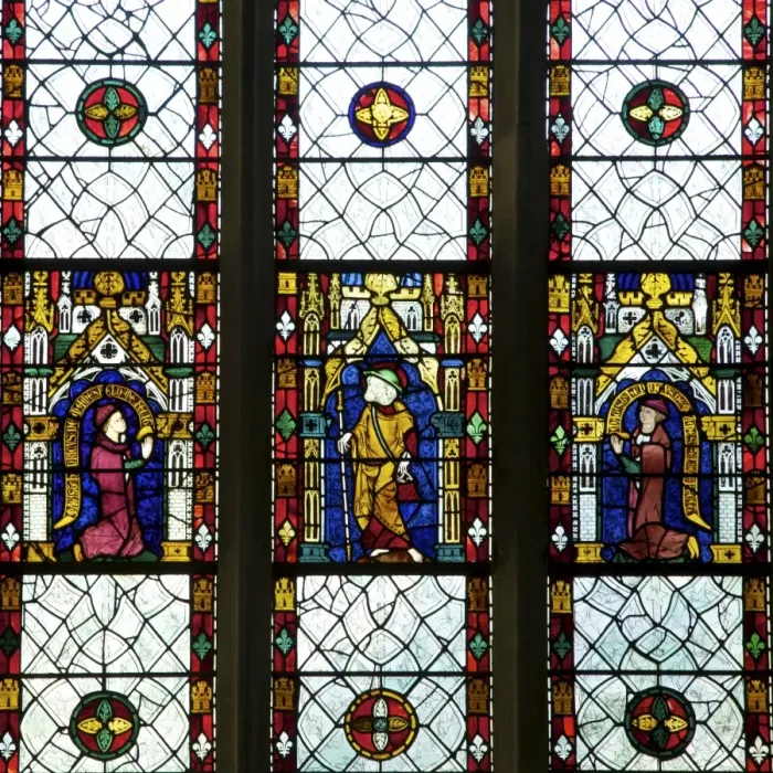 Framed Print : Close-up of 13th and 14th century stained glass windows of saint with kneeling patrons