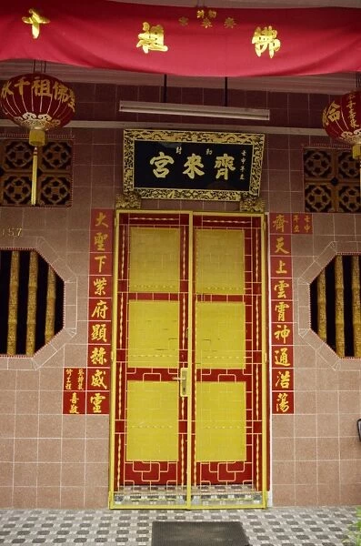 Close-up of a bright red and yellow door to a restored