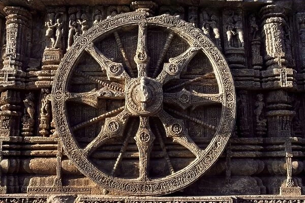 Close-up of carved chariot wheel