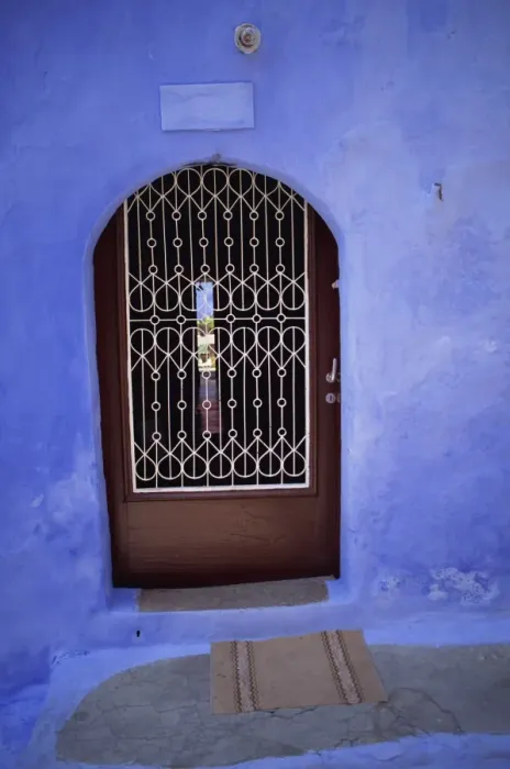 Framed Print : Close-up of doorway with grille built into blue wall Framed Print : Close-up of doorway with grille built into blue wall