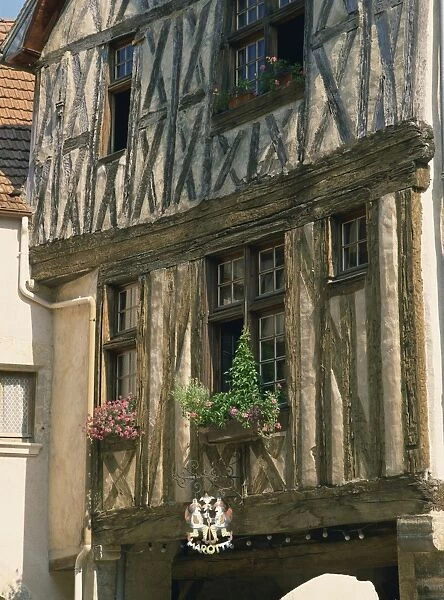 Close-up of exterior of a timber framed house in the village of Noyers sur Serein