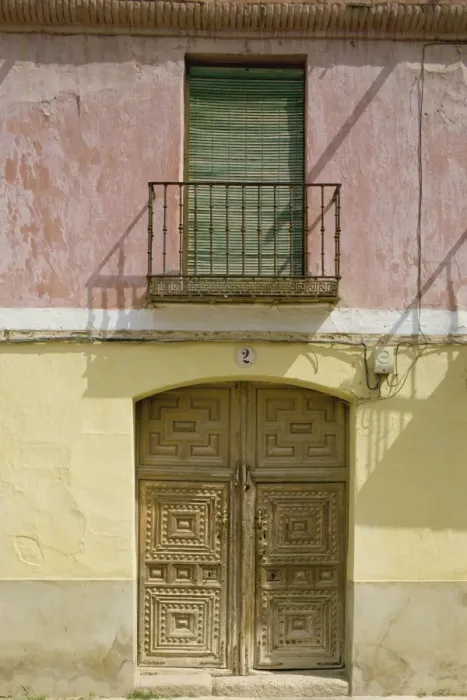 Framed Print : Close-up of exterior of a wooden door and small balcony
