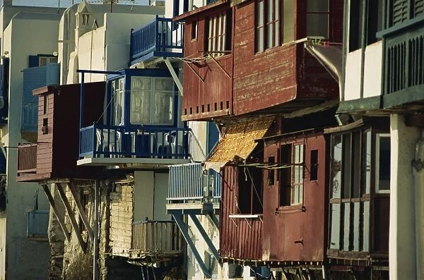 Close-up of exteriors of painted wooden balconies in