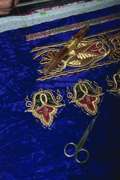 Close-up of gold embroidery work in a factory in Bukhara