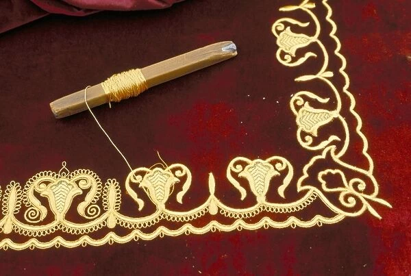 Close-up of gold work embroidery