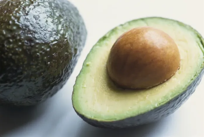 Framed Print : Close-up of half an avocado pear, with stone Framed Print : Close-up of half an avocado pear, with stone
