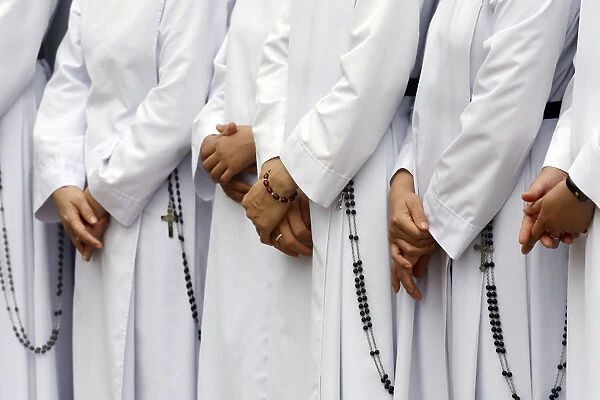 Close-up on hands and rosary, Dominican sisters, Bien Hoa, Vietnam, Indochina