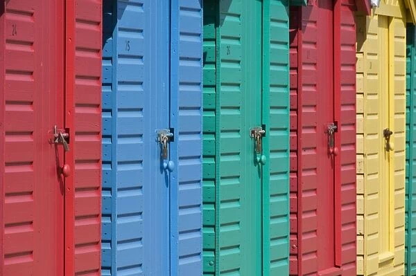 Close-up of multicoloured beach huts on the long sweeping beach of Llanbedrog