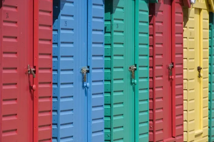 Framed Print : Close-up of multicoloured beach huts on the long sweeping beach of Llanbedrog Framed Print : Close-up of multicoloured beach huts on the long sweeping beach of Llanbedrog