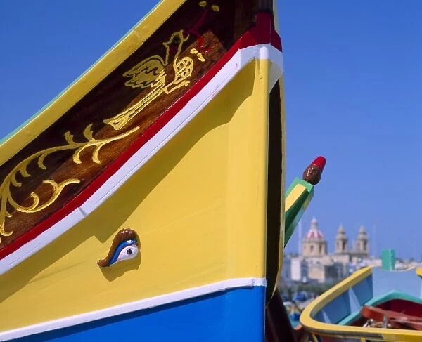 Close-up of a painted fishing boat with eye motif in