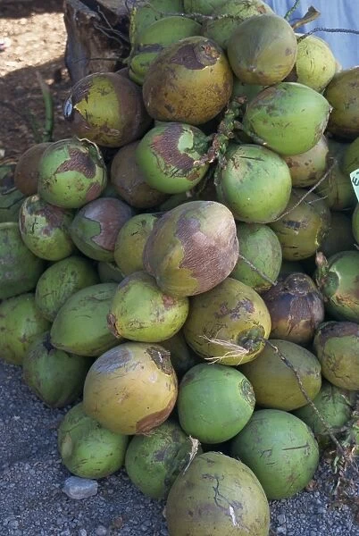 Close-up of a pile of green coconuts