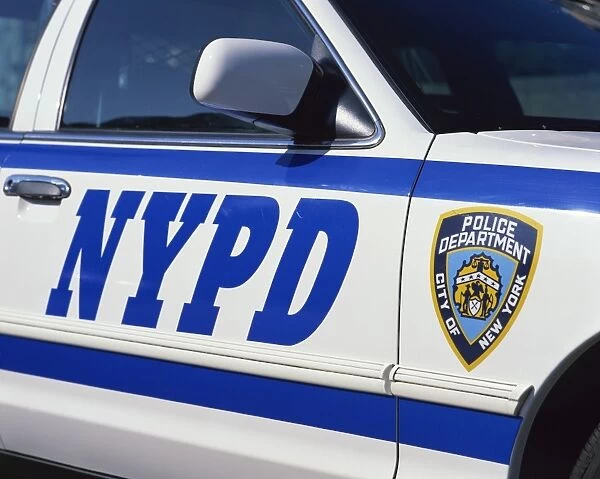 Close-up of police car with insignia of the City of New York Police Department