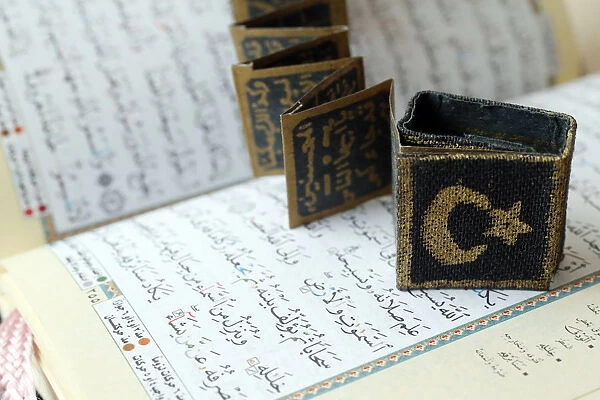 Close-up of Quran, crescent, star and surats, Muslim symbols, Vietnam, Indochina