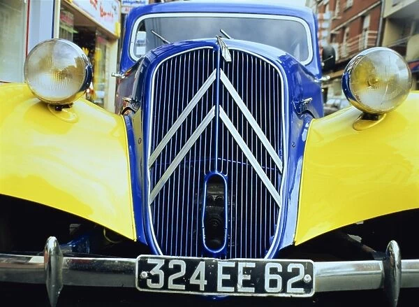 Close-up of front radiator, number plate and lamps on a Citroen 4CV in France, Europe