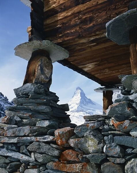 Close-up of rocks and wooden building of an old raccard at Findeln