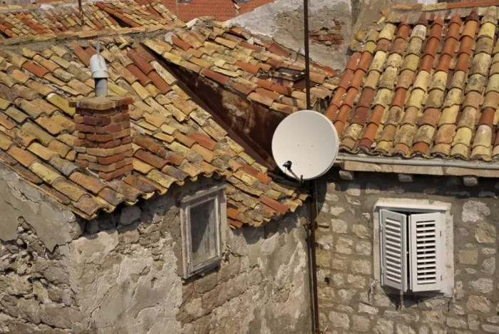 Framed Print : Close-up of roof tiles, old stone walls and satellite dish in the old town of Dubrovnik Framed Print : Close-up of roof tiles, old stone walls and satellite dish in the old town of Dubrovnik