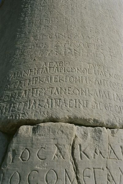 Close-up of script carved in stone
