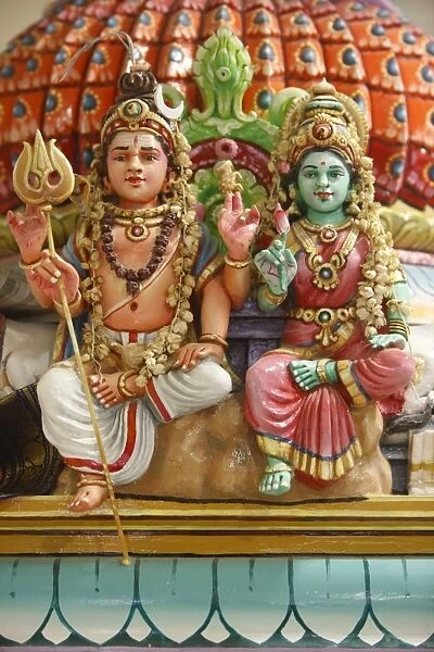 Close-up of Shiva and Parvati statues in Hindu temple, France, Europe