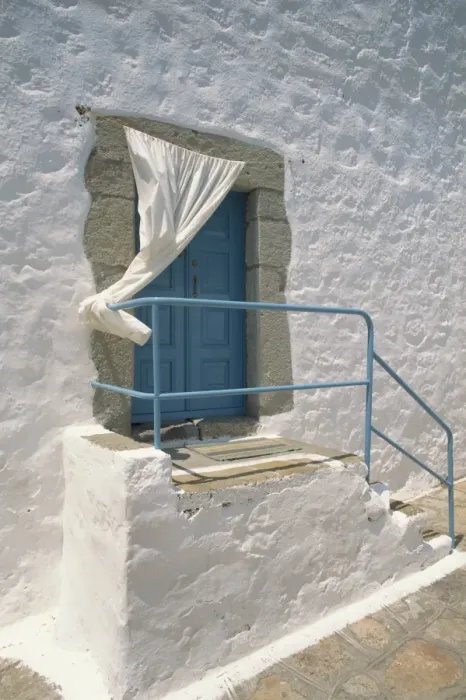 Framed Print : Close-up of stairs with blue rail and door of a whitewashed Framed Print : Close-up of stairs with blue rail and door of a whitewashed