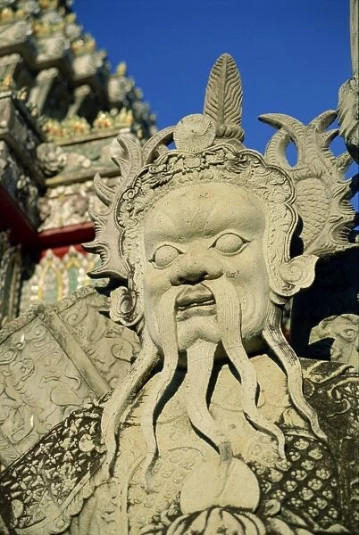 Close-up of the statue of a Chinese guard at the temple
