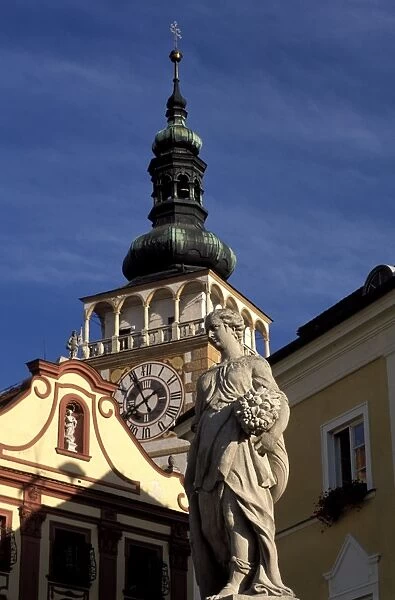 Close-up of statue on Nemesti and church clock tower of Mikulov, Mikulovska wine region