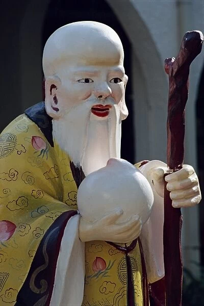 Close-up of a statue of an old Chinese Confucian sage