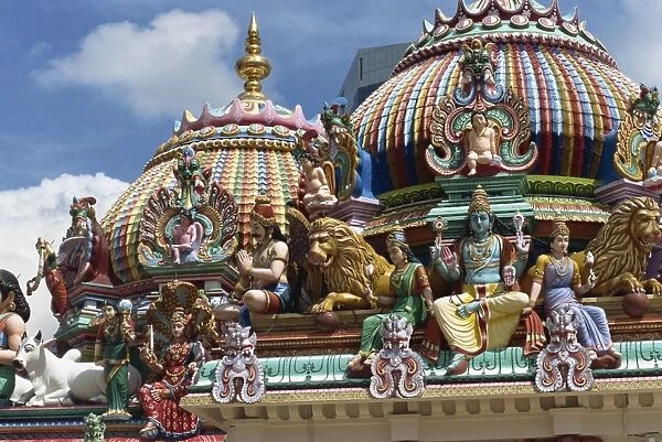 Close-up of statues and domes on the roof of the Sri Mariamman Temple