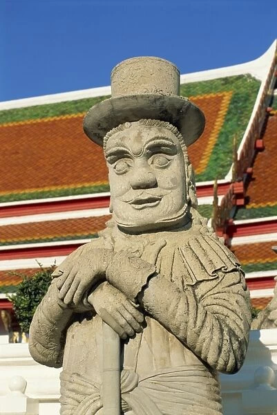 Close-up of a stone statue of a Farang guard at the