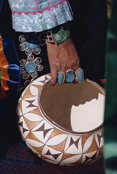Close-up of turquoise jewellery on the hand of an Indian