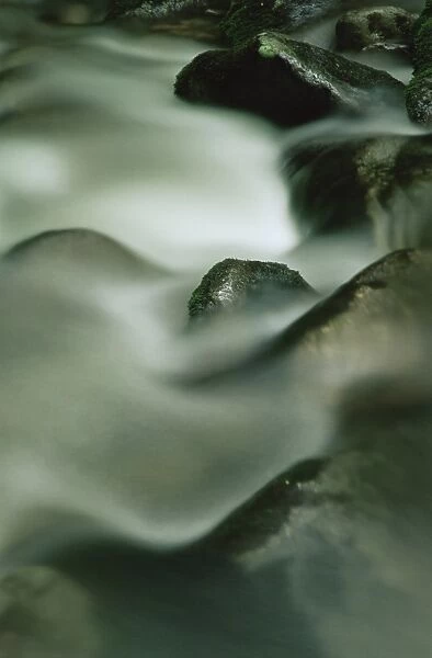 Close-up of water over rocks