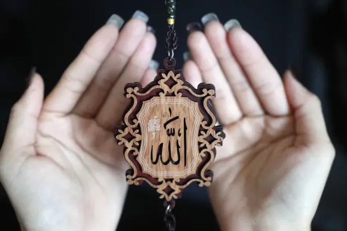 Framed Print : Close-up of the word Allah in Arabic calligraphy and woman praying, Vietnam, Indochina Framed Print : Close-up of the word Allah in Arabic calligraphy and woman praying, Vietnam, Indochina