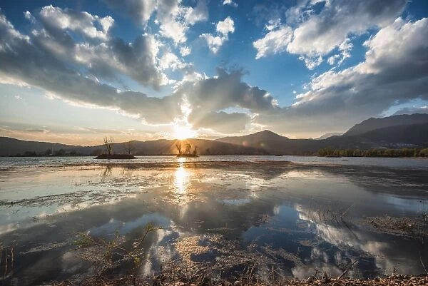 Cloud reflections at a lake in Lijiang, Yunnan, China, Asia