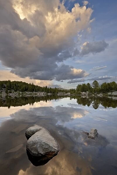 Cloud at sunset reflected in an unnamed lake, Shoshone National Forest