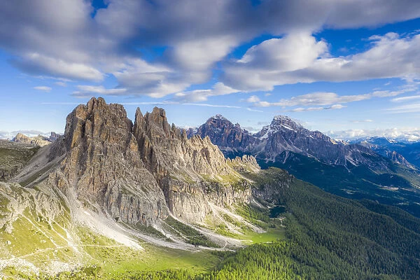Clouds over Cima Ambrizzola, Tofane and Federa Lake surrounded by woods, Dolomites