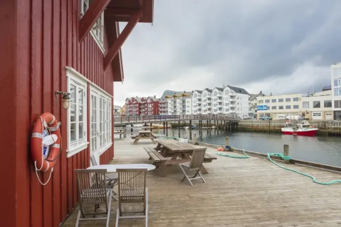 Framed Print : Clouds frame the typical wooden houses of the fishing village surrounded by sea, Svolvaer Framed Print : Clouds frame the typical wooden houses of the fishing village surrounded by sea, Svolvaer