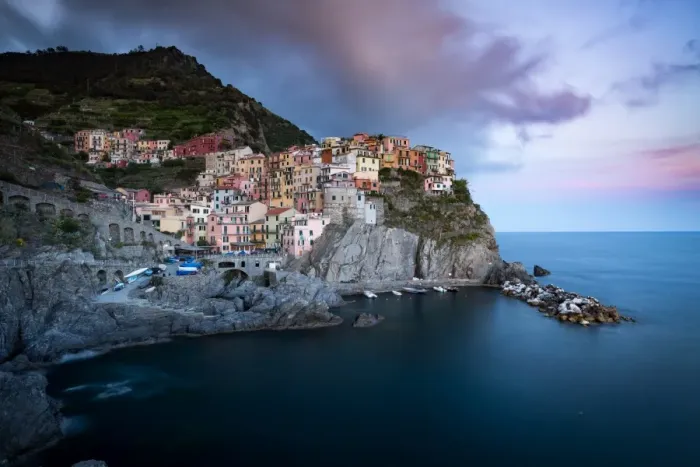 Framed Print : The clouds over Manarola light up with the colours of sunset during a long exposure Framed Print : The clouds over Manarola light up with the colours of sunset during a long exposure